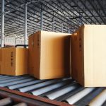 Boxes on a conveyor belt in a factory