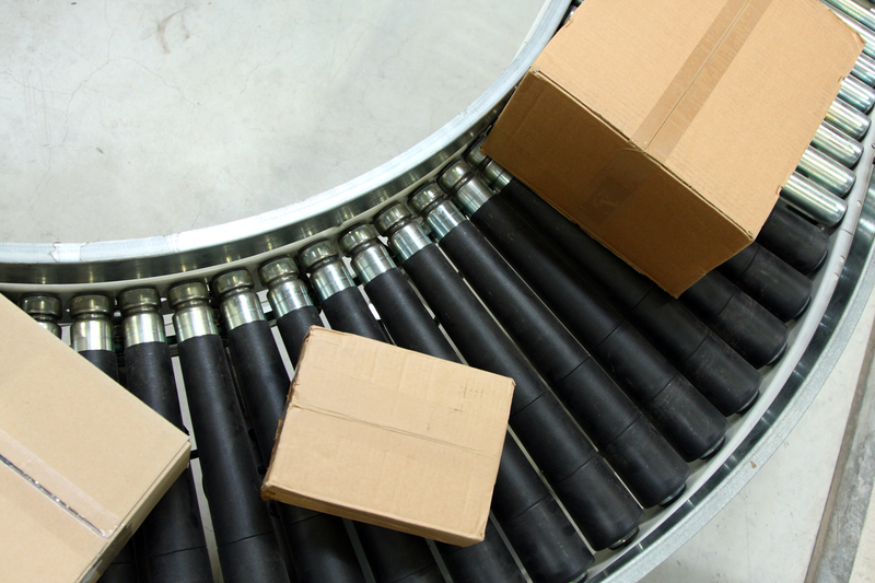 Boxes on conveyor belt in factory 